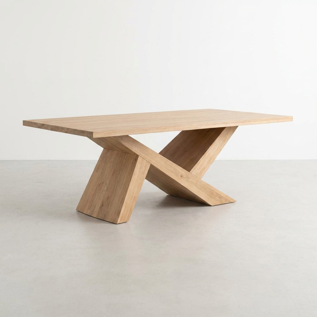Wooden table with an intersecting X-shaped base design.