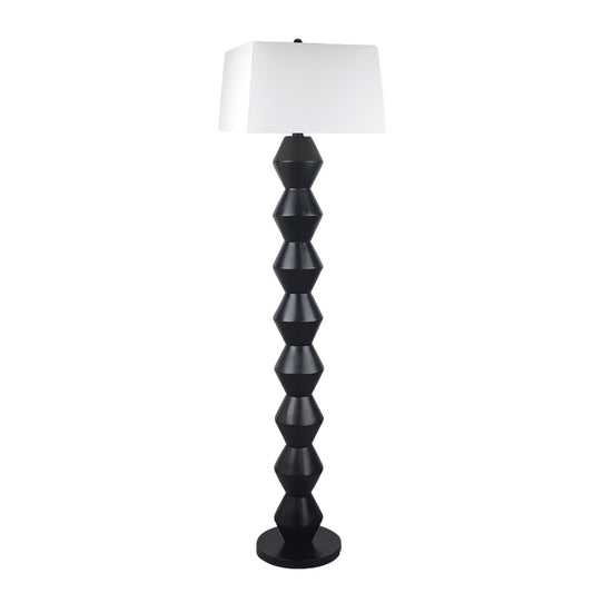 Modern floor lamp with geometric black base and white shade.