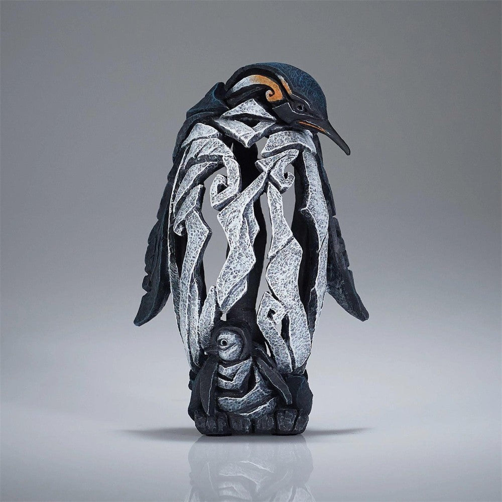 Penguin sculpture with intricate, abstract design.