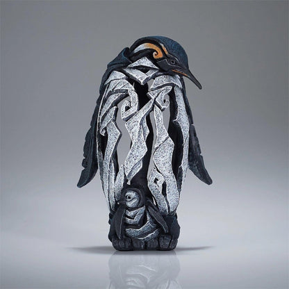 Penguin sculpture with intricate, abstract design.