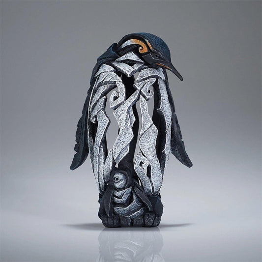 Penguin sculpture with intricate, abstract design.