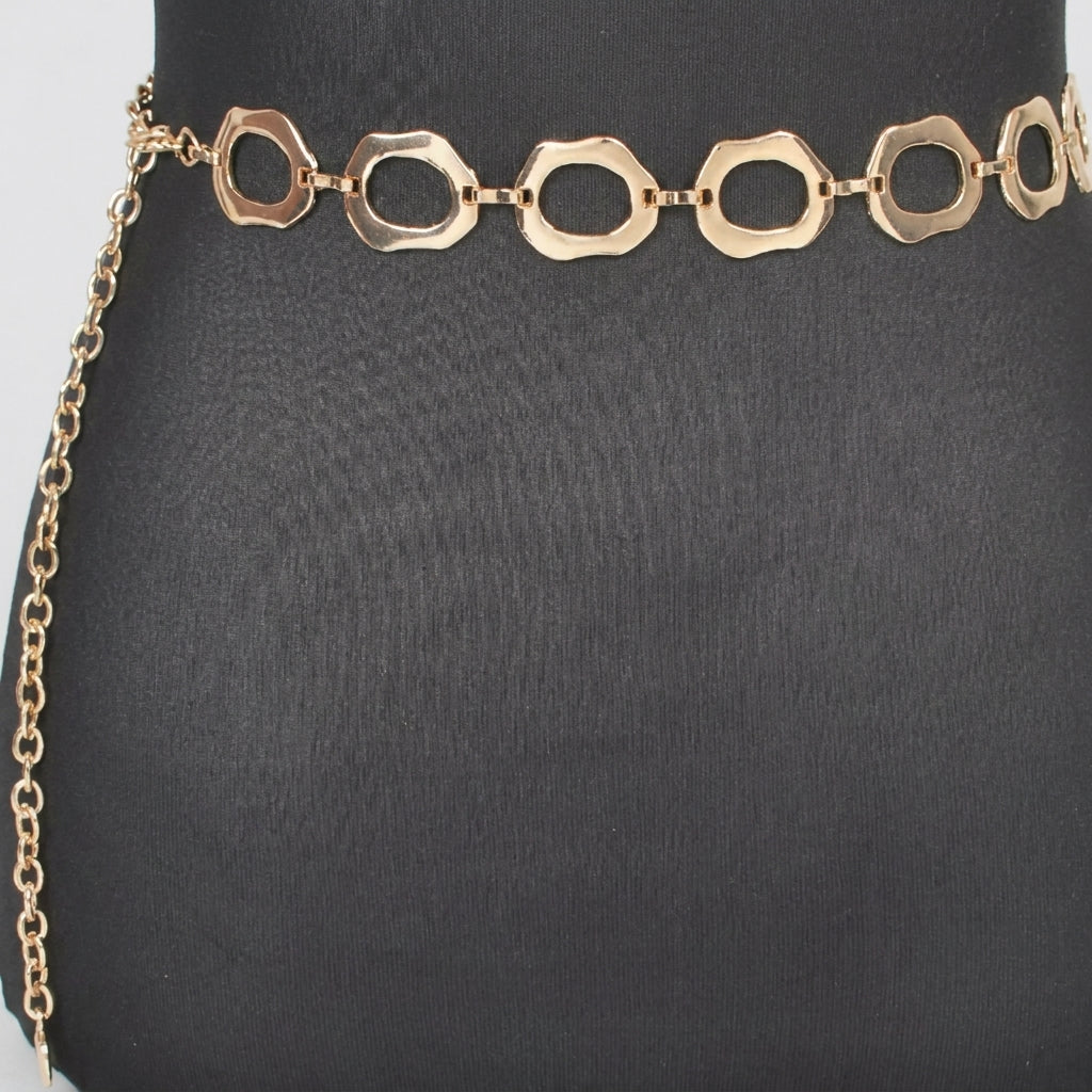 Gold chain belt with open geometric links on a black background.