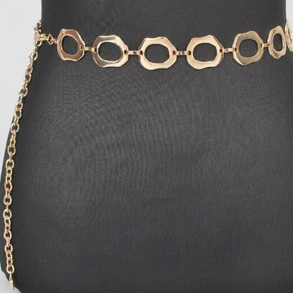 Gold chain belt with open geometric links on a black background.