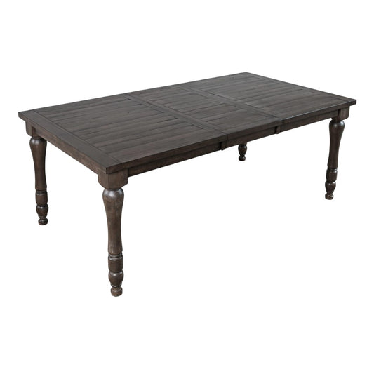 Dark wooden dining table with turned legs.