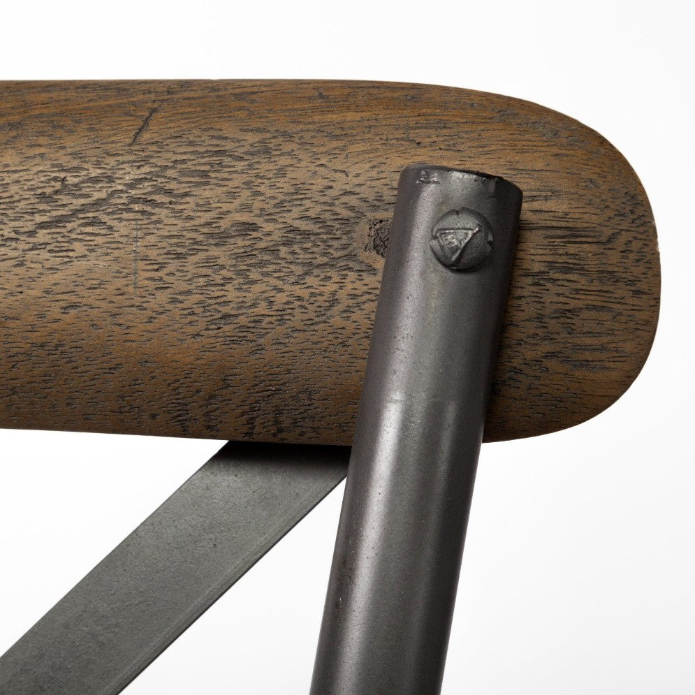 Close-up of a wooden surface with metal support and screws.