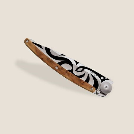 Elegant knife with a wooden handle and tribal design.