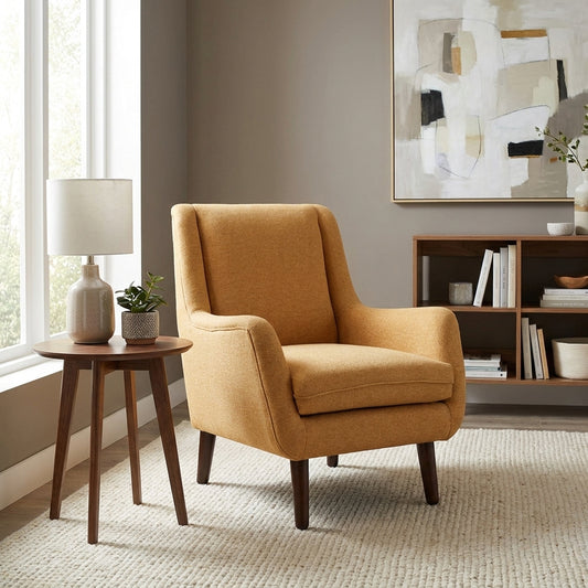 Tan fabric armchair with dark wooden legs.