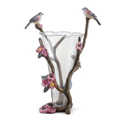 Elegant glass vase with bird and flower accents.