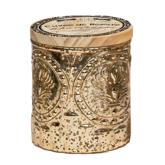Gold-embossed jar with intricate designs and a wooden lid.