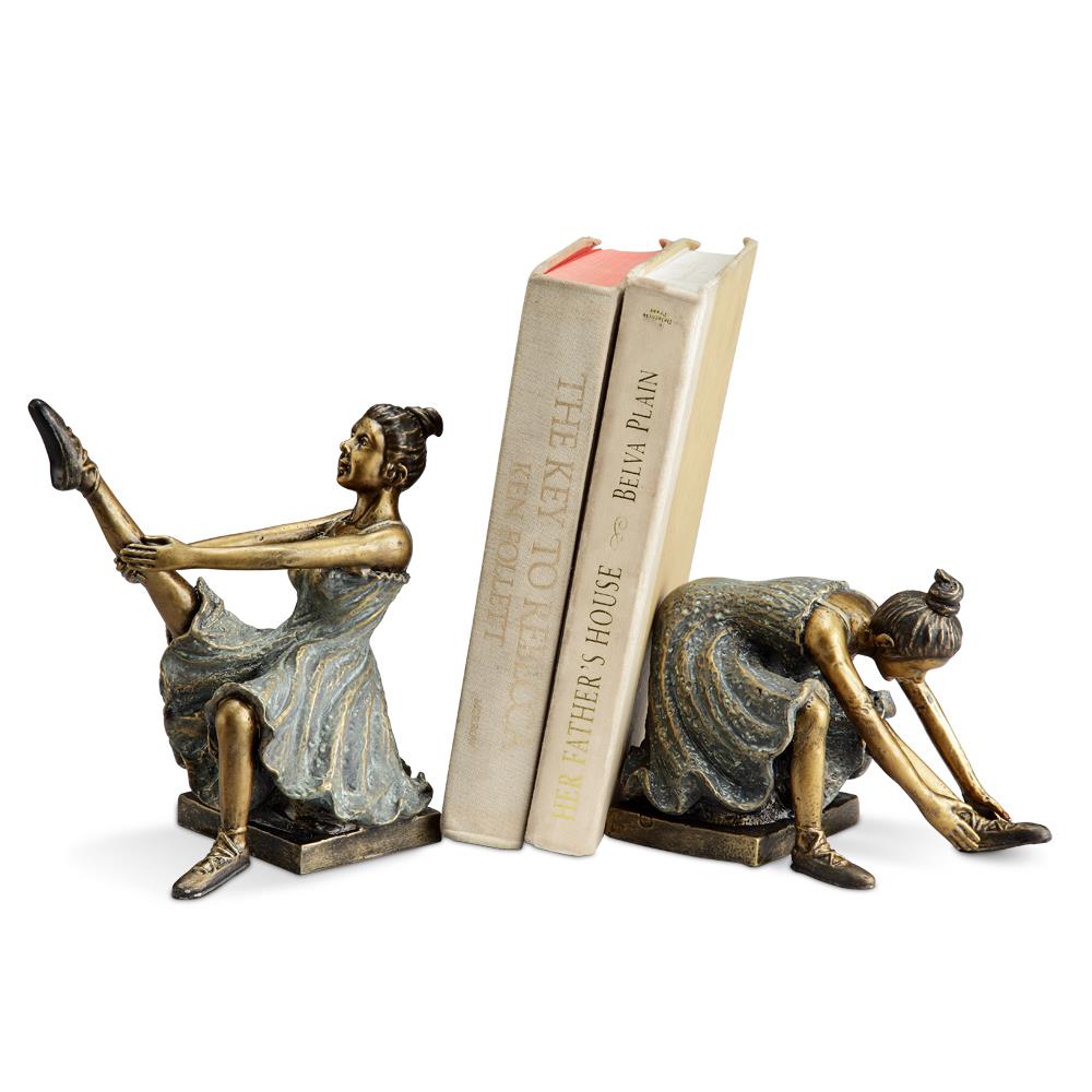 Two ballerina bookends holding books upright.