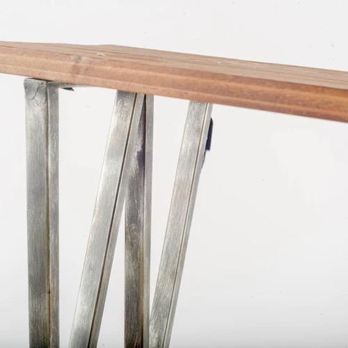 Wooden tabletop with angled metal supports.