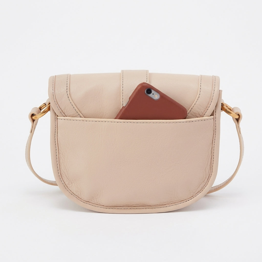 Beige leather purse with a phone in the front pocket.