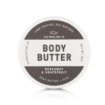 Round container of body butter with bergamot and grapefruit scent.
