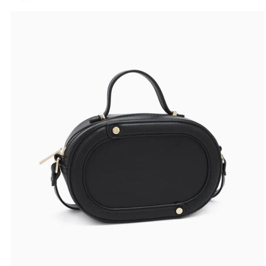 Black oval handbag with a top handle and gold accents.