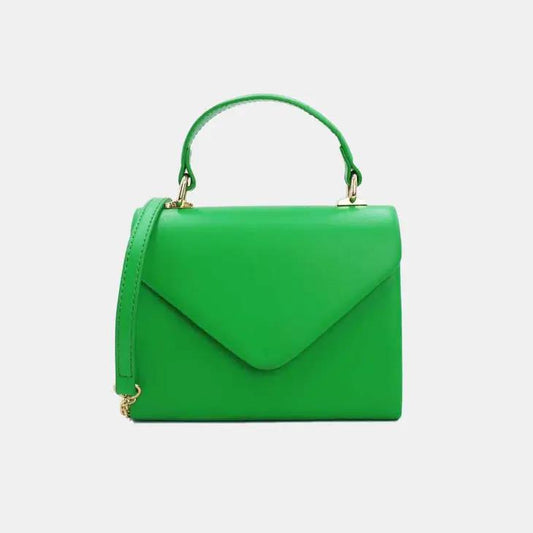 Bright green handbag with handle and strap on a white background.