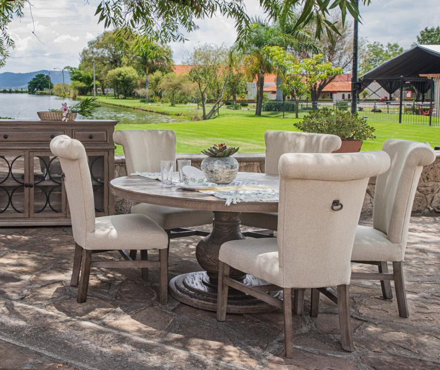 Outdoor dining set with a garden view by the water.