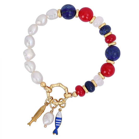 Colorful bead bracelet with fish charms and gold accents.