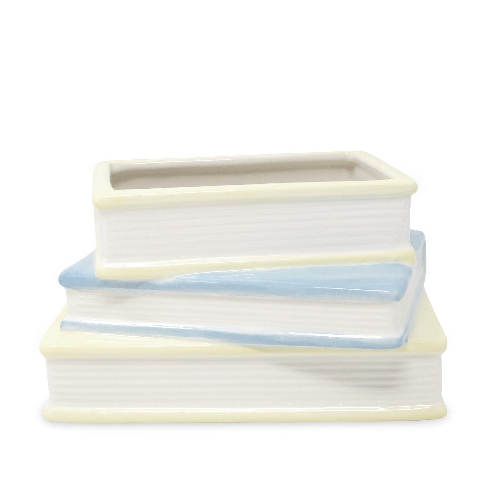 Two ceramic stacked books, one with an open lid on top.