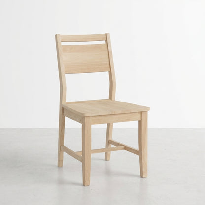Simple wooden chair on a light-colored floor.