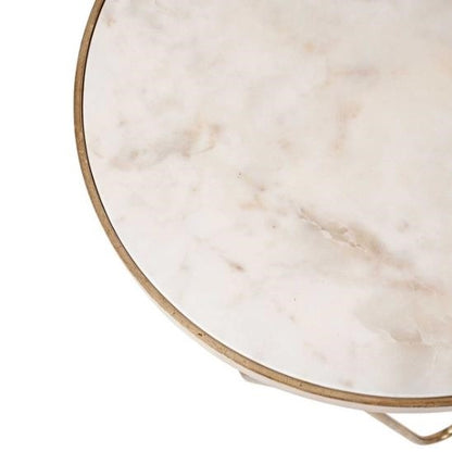 Round marble table with a thin metal edge.