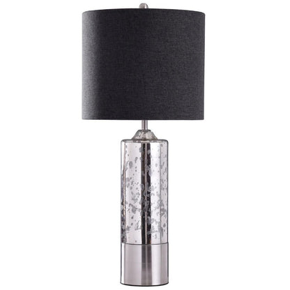 Modern lamp with a mercury glass base and a black drum shade.