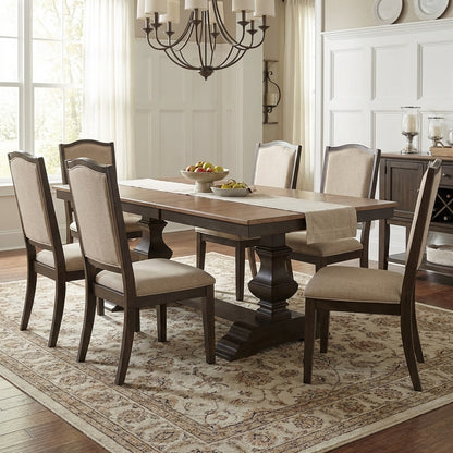Wooden dining table with pedestal legs.