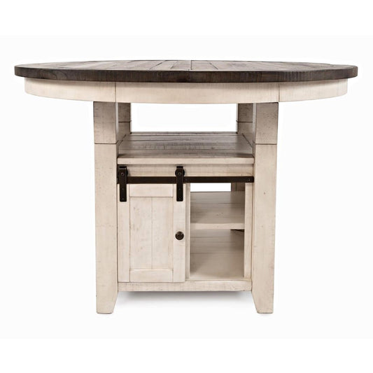 Rustic round table with storage cabinet underneath.