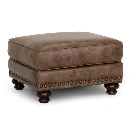 Brown leather ottoman with wooden legs and studded trim.