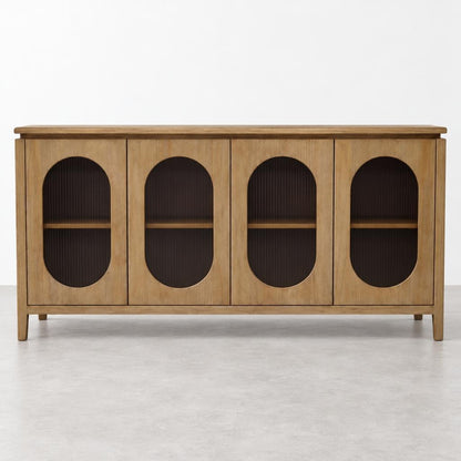 A wooden sideboard with four arched, dark-paneled doors stands against a white wall.