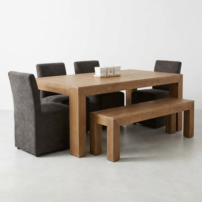Wooden dining table set with chairs and a bench.