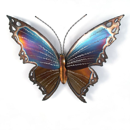 Colorful, intricate metal butterfly art on white background.