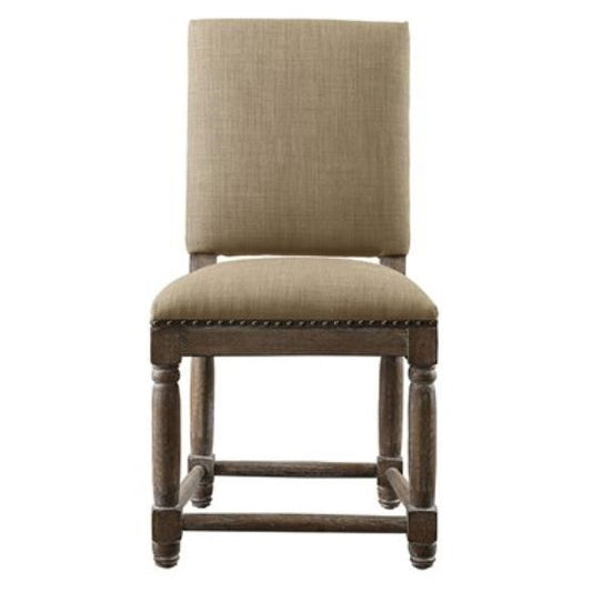 Wooden chair with beige upholstery and nailhead trim.