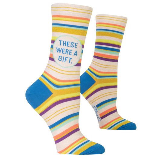 Colorful socks with stripes and "THESE WERE A GIFT" text.