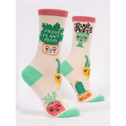 Colorful socks with quirky plant pot faces and "Proud Plant Mom" text.