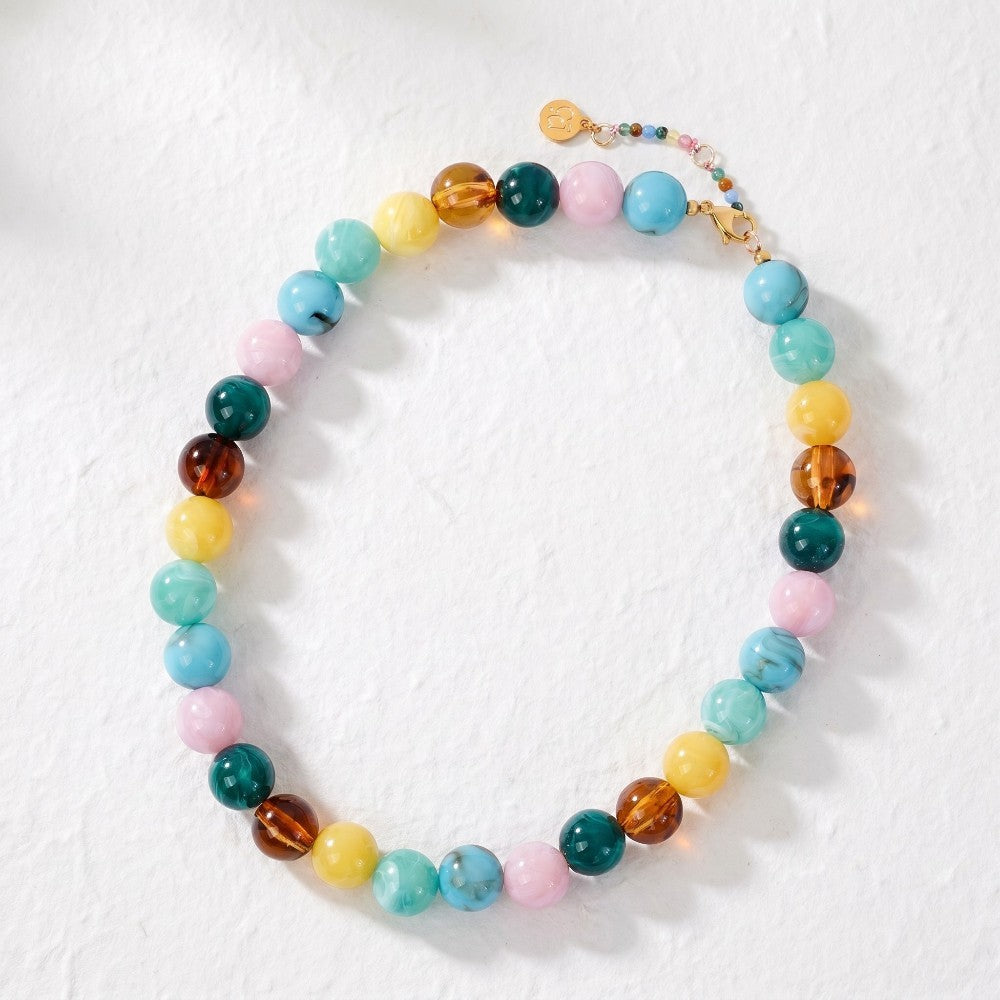 Colorful beaded necklace with various round stones.
