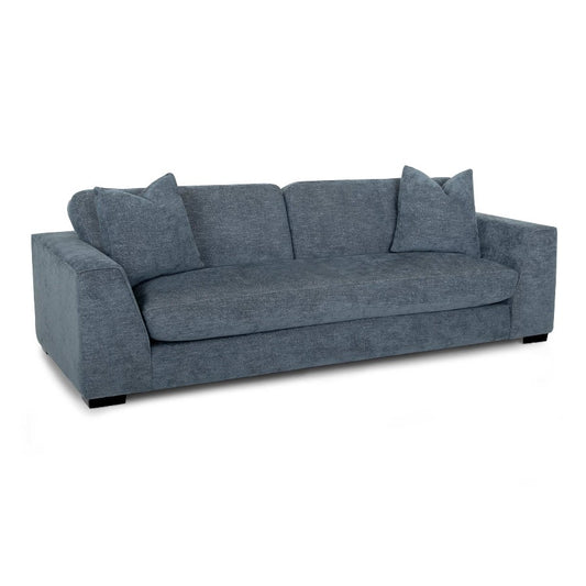 Gray fabric sofa with wide armrests and three cushions, on dark legs.