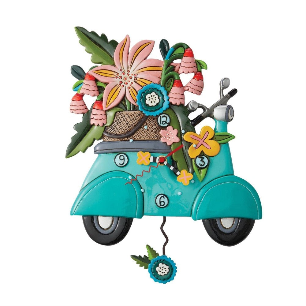 Colorful scooter clock adorned with flowers and tropical decor.