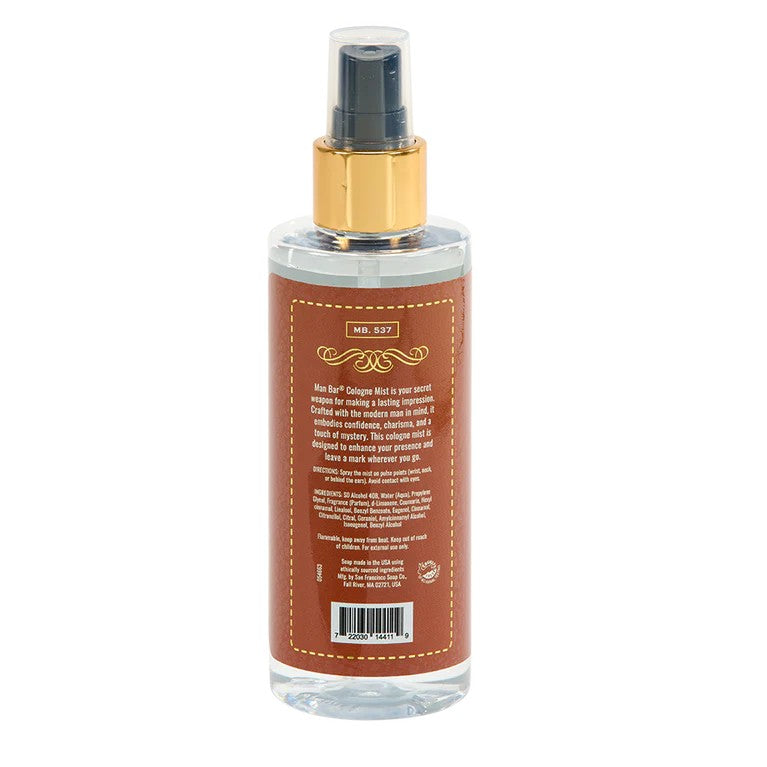 Cologne mist bottle with brown label and gold cap.