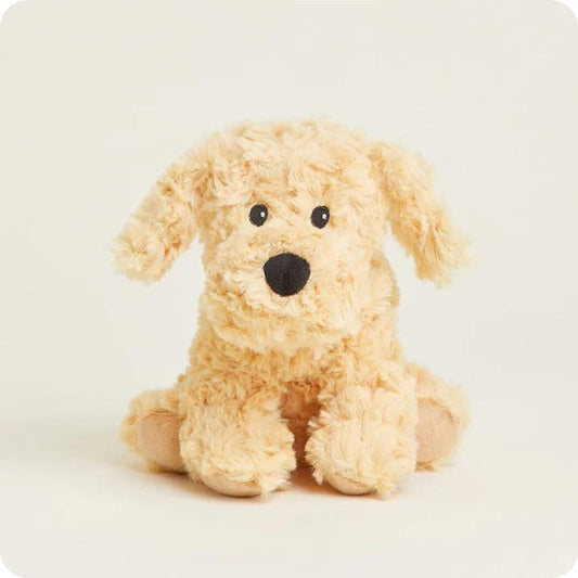 Fluffy beige stuffed dog with a black nose.