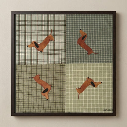 Framed patchwork with plaid patterns and brown dachshunds in various poses.
