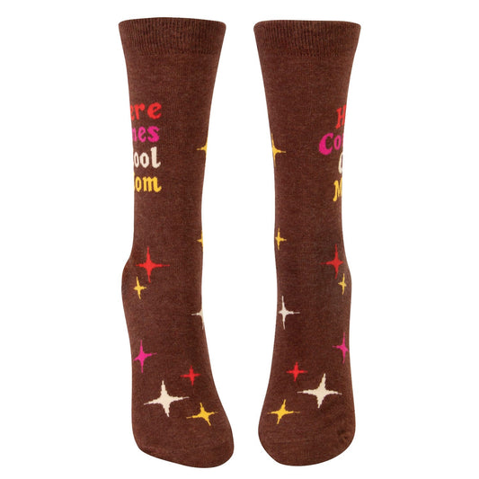 Brown socks with colorful star patterns and "Here Comes Cool Mom" text.
