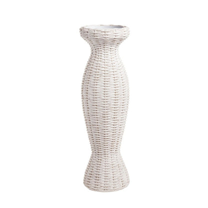 Tall white wicker vase with a flared top and textured ridges.