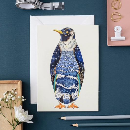 Colorful penguin artwork on a greeting card.
