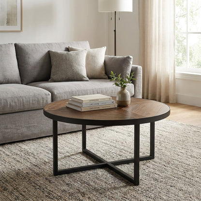Round wooden table with metal legs and a geometric design.