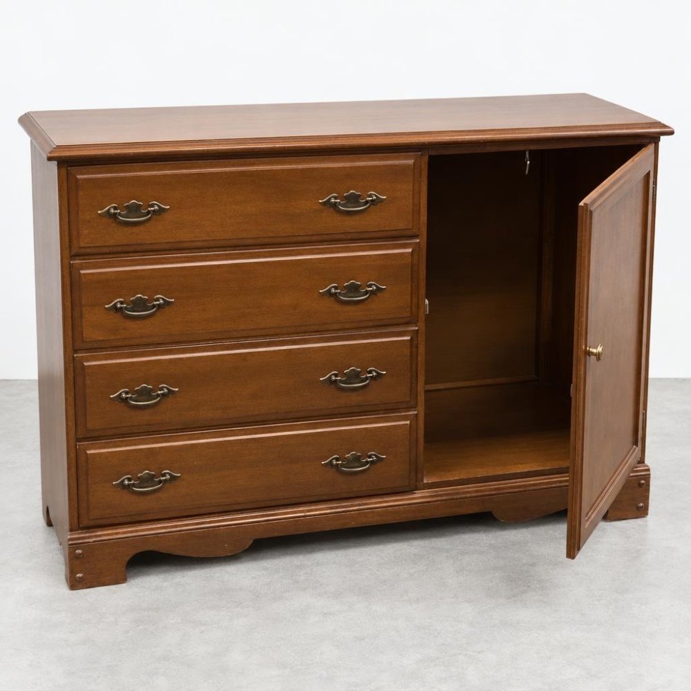 Wooden dresser with four drawers and one open cabinet door.