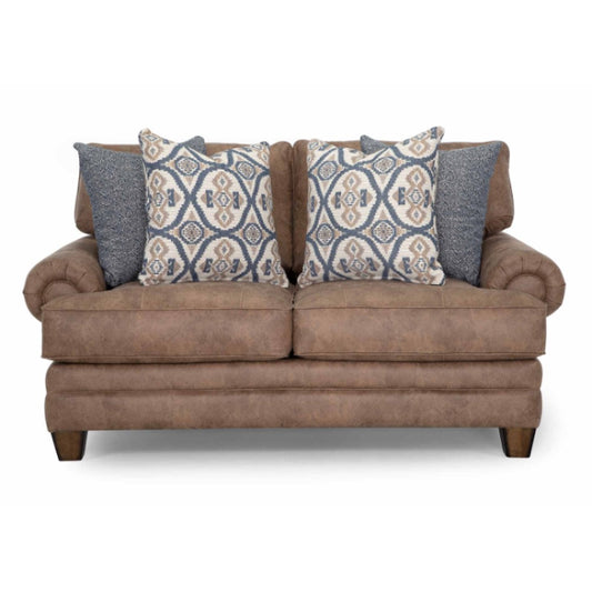 Brown loveseat with patterned and textured pillows.