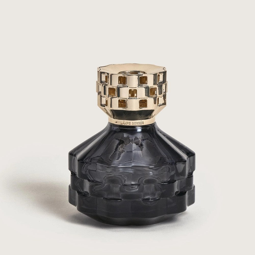Black decorative bottle with a gold cap.