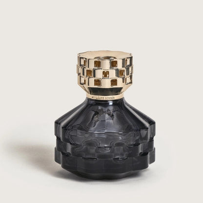 Black decorative bottle with a gold cap.