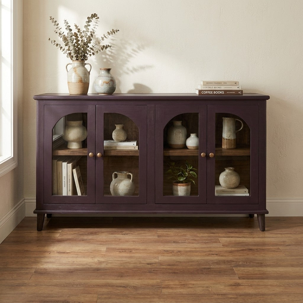 Wooden cabinet with decor and books, on a wooden floor.
