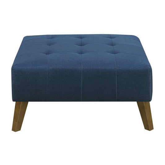 Blue tufted ottoman with wooden legs.